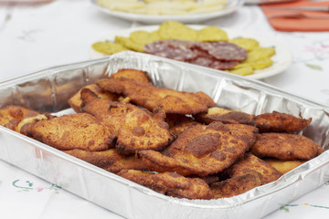 Breaded chicken fillets in aluminium tray