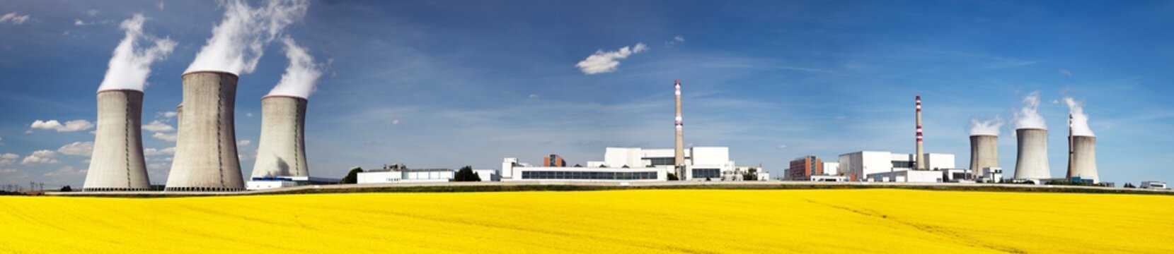 Nuclear power plant Dukovany with golden glowering field