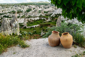 Pitchers on the background of rocks. Cappadocia. Turkey