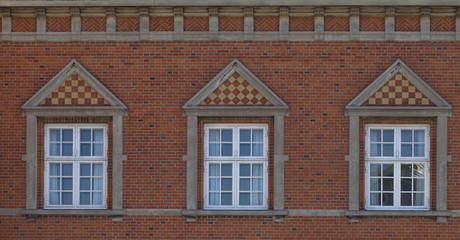 Three Windows. Three windows in a row all the same. They are decorated with traditional Danish...