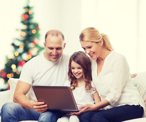 Fototapeta na wymiar happy family with laptop computer
