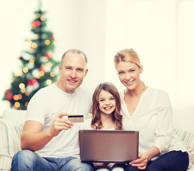 happy family with laptop computer