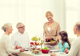 smiling family having holiday dinner at home