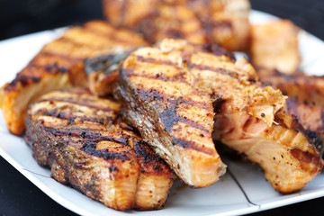 Salmon fish roast on barbecue grill.