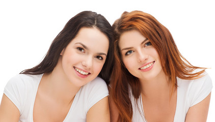 two laughing girls in white t-shirts