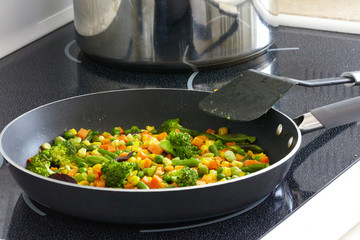 Vegetables mix on frying pan.