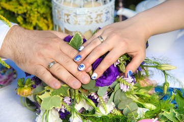 Fototapeta premium the bride and groom hands closeup