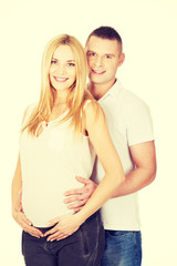 Fototapeta premium Beautiful young couple expecting baby