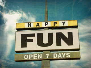 aged and worn vintage photo of happy fun sign