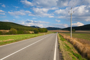 On the empty road between  field