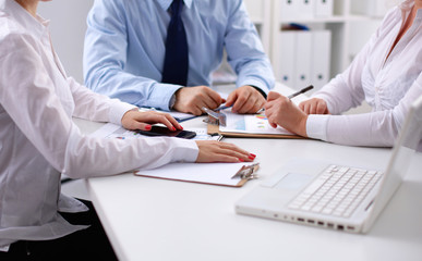 Business people, sitting at the table