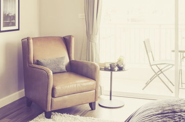 classic brown leather chair in bedroom