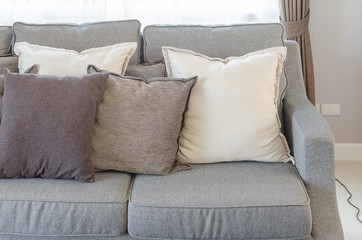 modern grey sofa with pillows