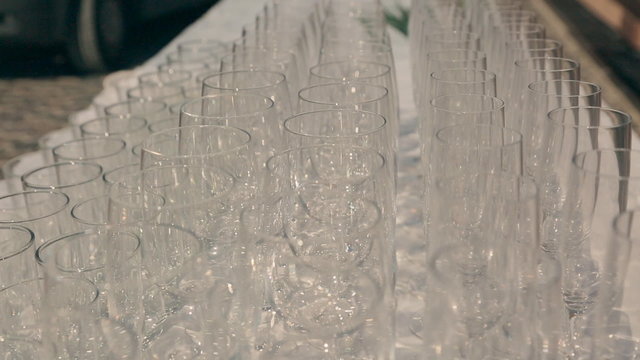 Row of empty glasses on a table at a banquet