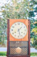old clock on nature background