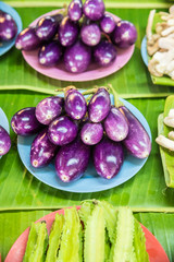 purple eggplant , eggplant in plastic dish at the marketplace of Thailand