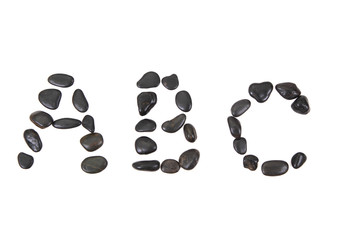 stone alphabet from black stones