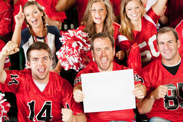Fans: Man Holds Small Blank Sign as Group Cheers to Camera