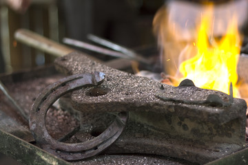 Fire place with metal tools and  horseshoe