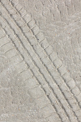 Fototapeta na wymiar car tire footprint on the sand