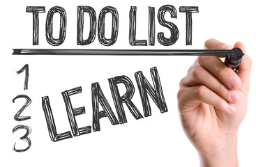 Hand with marker writing To Do List: Learn