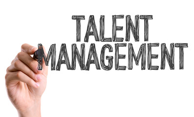 Hand with marker writing the word Talent Management