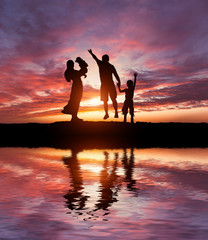 Silhouettes of happy family