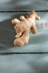 Top view, ginger root on wooden background