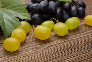 Grapes on wooden background