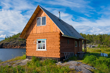 Fototapeta na wymiar the wooden house in the summer on the seashore