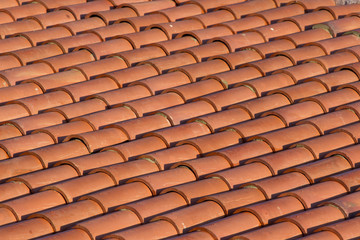 Orange tiles of a new home.  Beautiful background of clay tiles