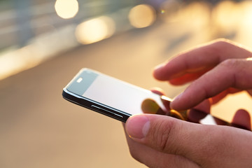 Man using his Mobile Phone outdoor