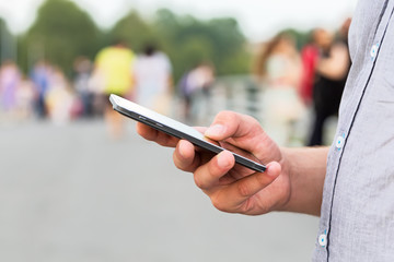 Man using his Mobile Phone outdoor