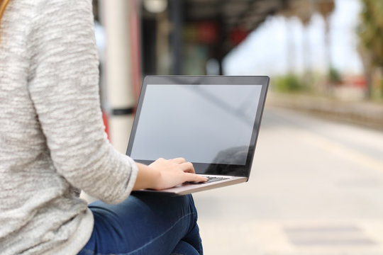 Entrepreneur Working With A Laptop In A Train Station