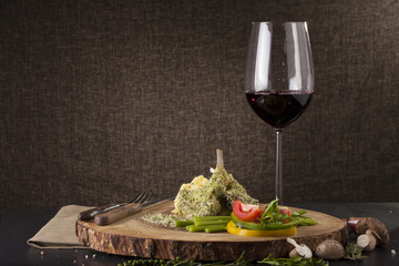 Rack of lamb mint steak, Rack of lamb steak cut in pieces seasoning with crusted mint vegetable and herbs and red wine serve on chopping wood block