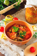 Home eggplant salad and vegetables on a wooden table
