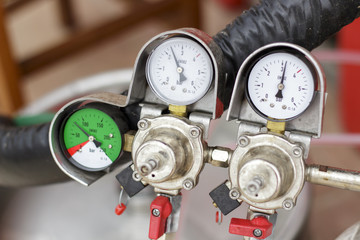 Nanometers of the nitrogen pressure regulator system on a draft beer faucet