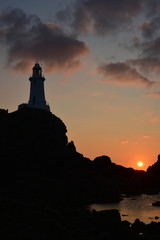 La Corbiere lighthouse, Jersey, U.K.   Coastal landmark at sunset in the Summer.