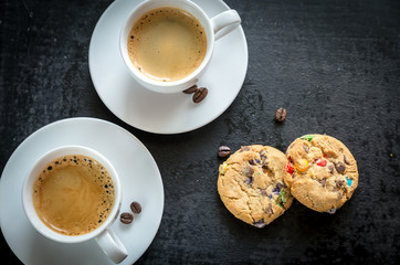 Two cups of coffee with  cookies