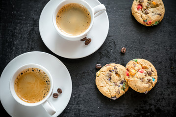 Two cups of coffee with  cookies