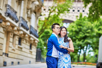 Fototapeta premium Young romantic Asian couple in Paris, France