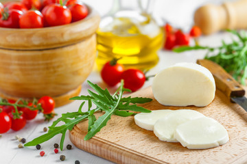 Cooking of salad with mozzarella and tomatoes