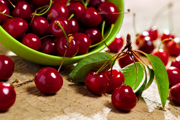 Bowl of fresh cherries on table