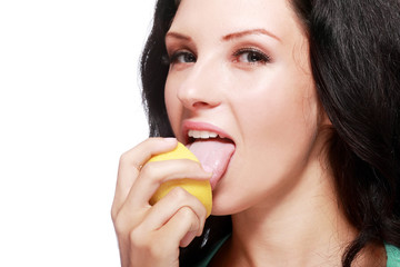 woman tasting lemon