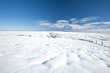 Fototapeta na wymiar Snowy winter countryside landscape scene