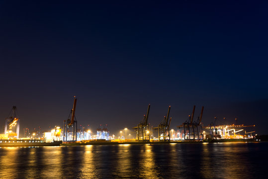 cranes and vessels at container terminal burchardkai in hamburg