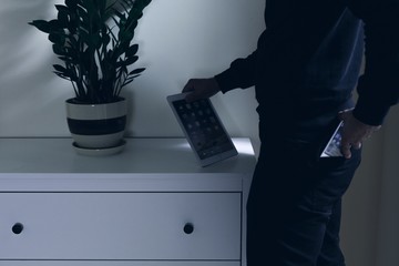 Thief stealing tablet