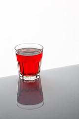 glass of cocktail  cherry on white background