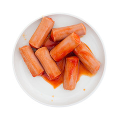 Plate of small bite size sausages in sauce