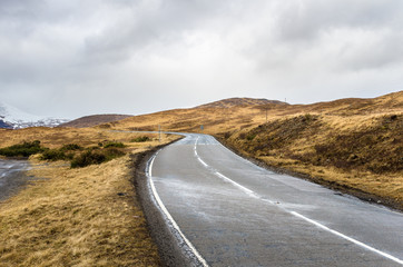 Curving Mountain Road in Scotland on a Rainy Day